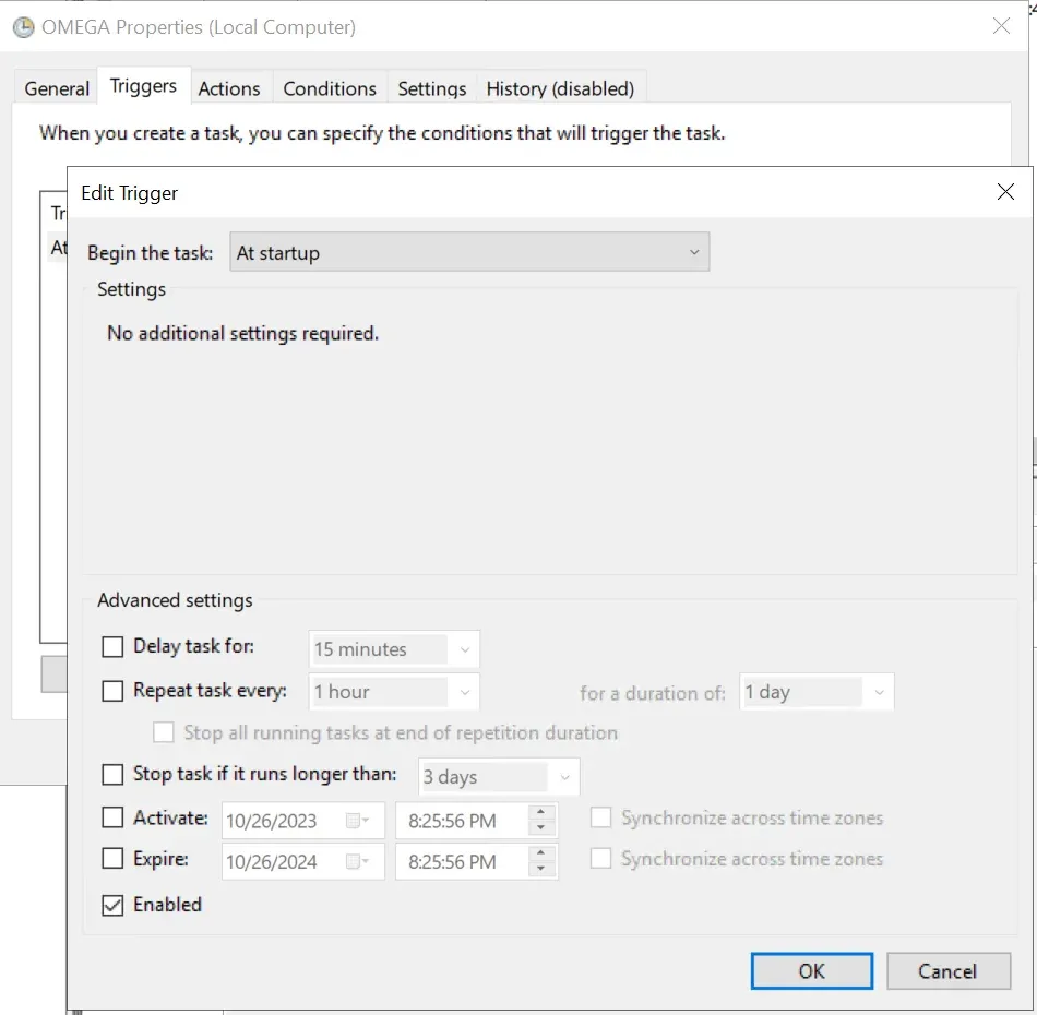 Edit Trigger dialog with “Begin the task” set to At startup and the Enabled checkbox ticked